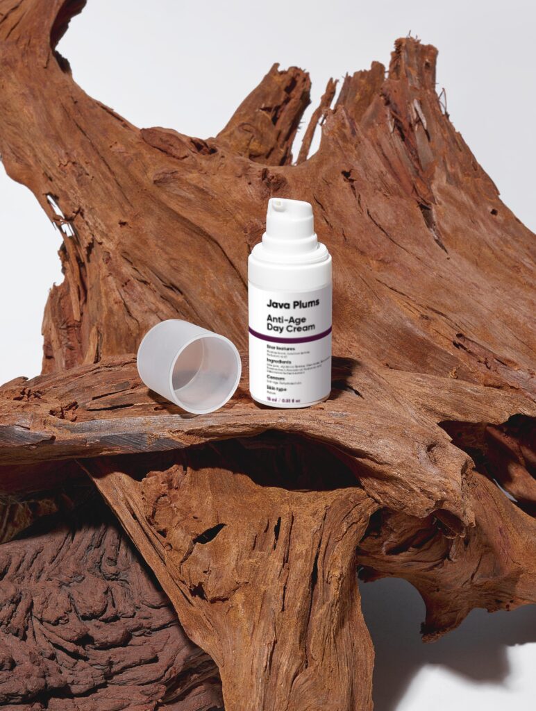 JavaPlums hydration cream, serum, and night oil on a wooden surface